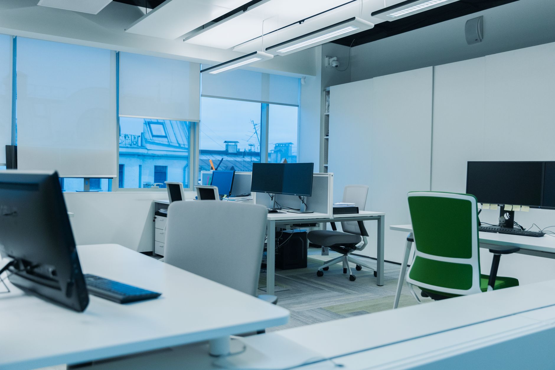 Herman Miller Aeron style mesh office chair near a white desk