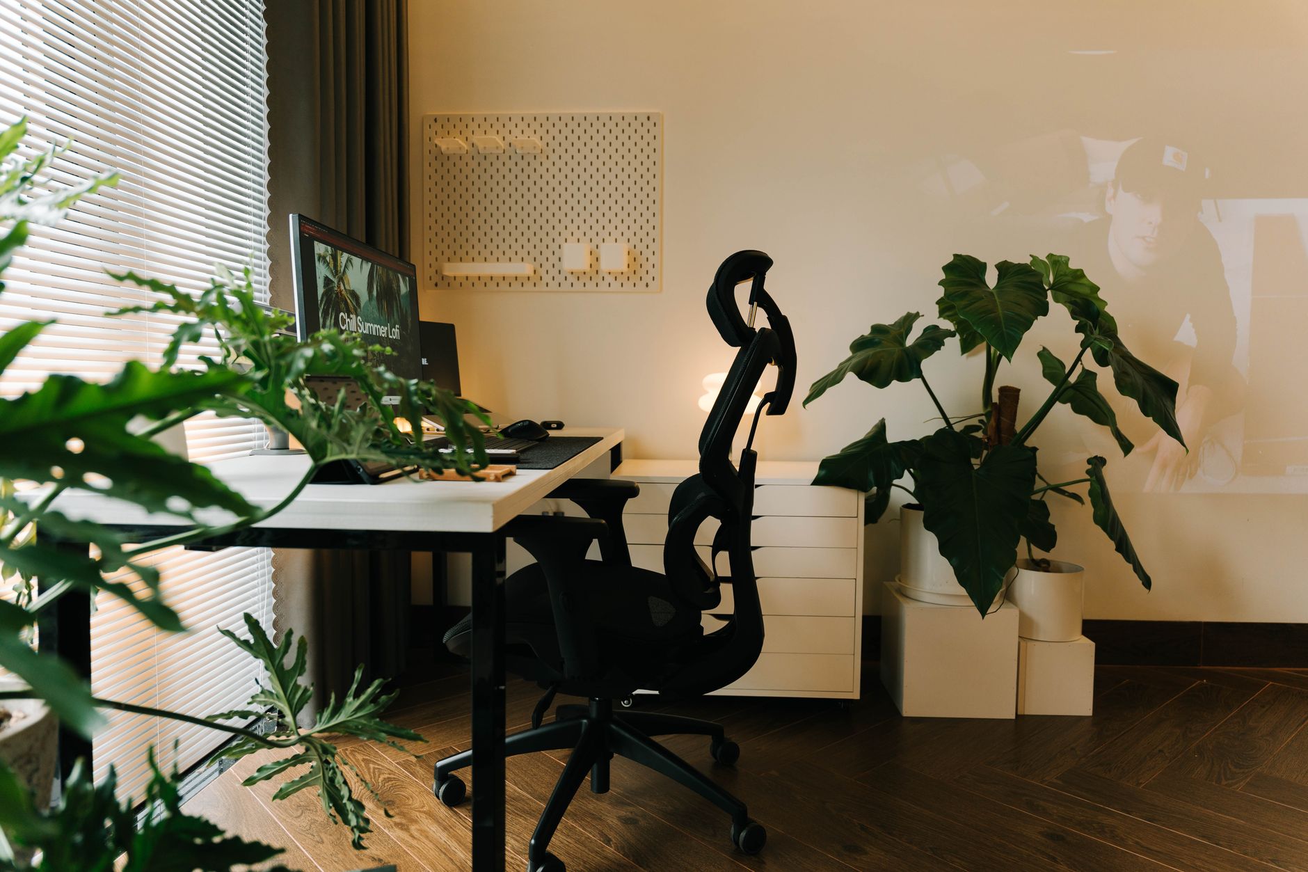 Budget ergonomic chair with headrest next to a small desk