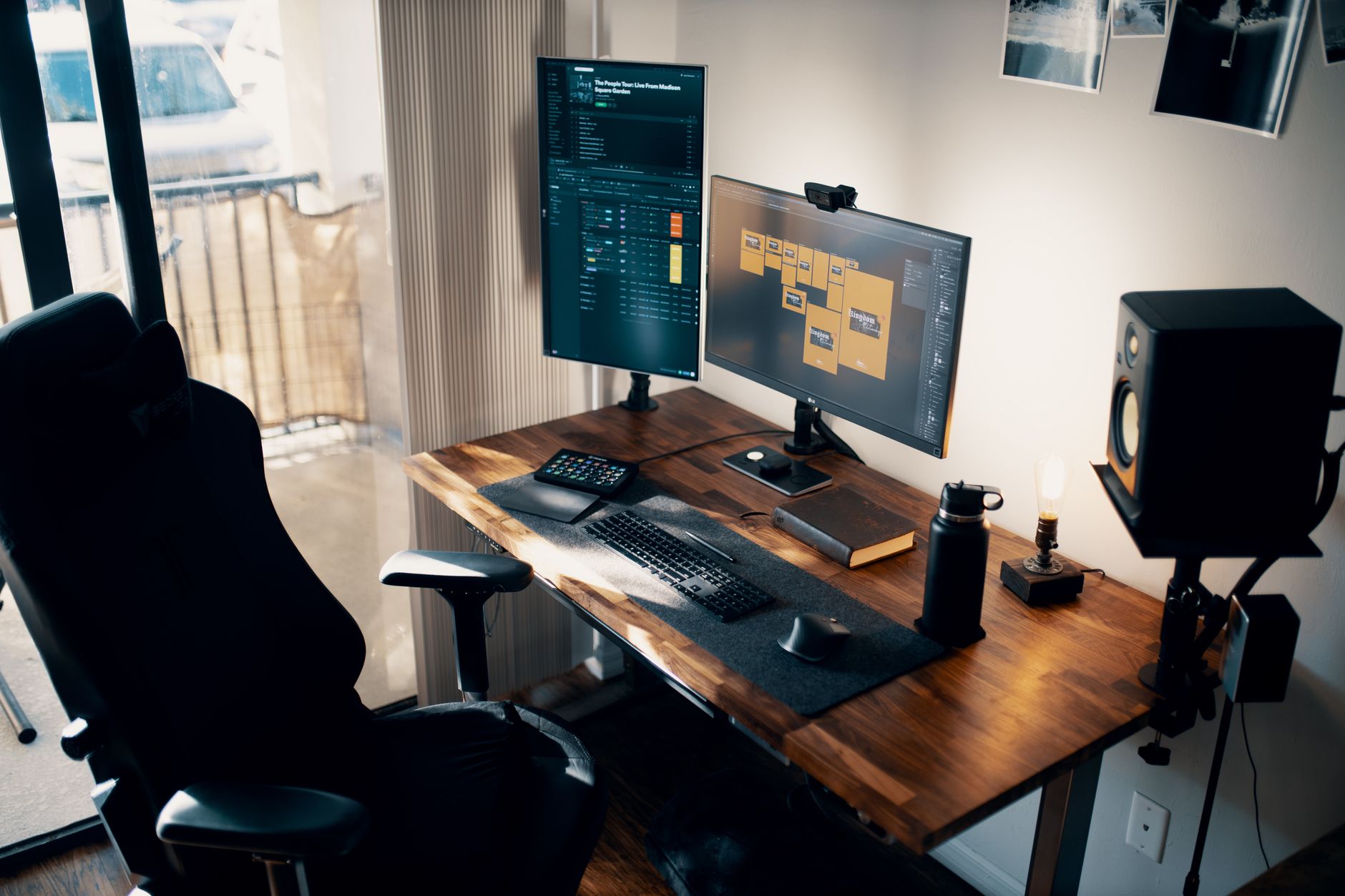 Tall dual monitor arm holding two monitors on a white standing desk