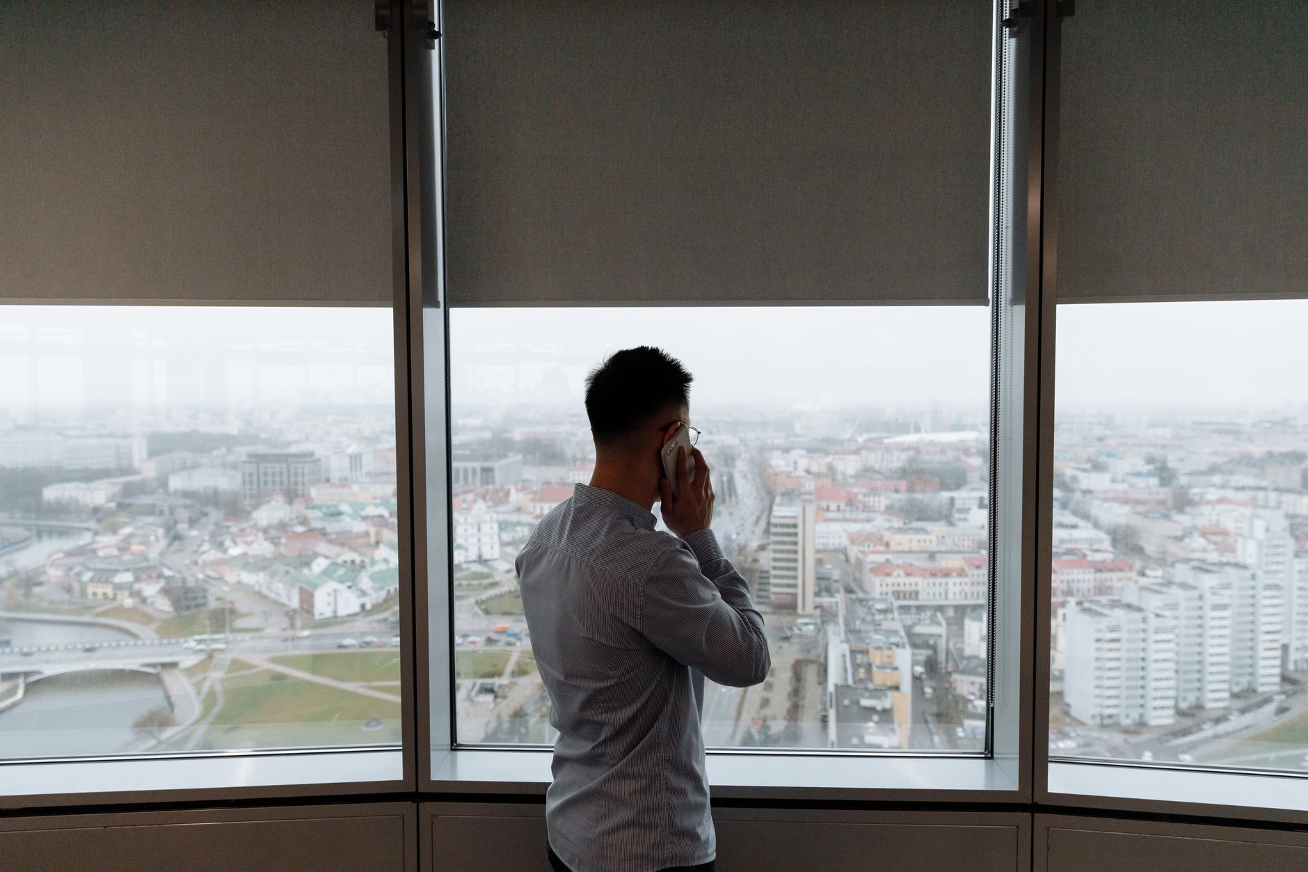 Desk worker looking out a window to relax eyes during a screen break
