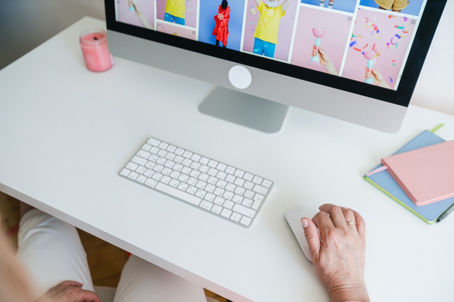 a person using an ergonomic keyboard and vertical mouse at a clean desk