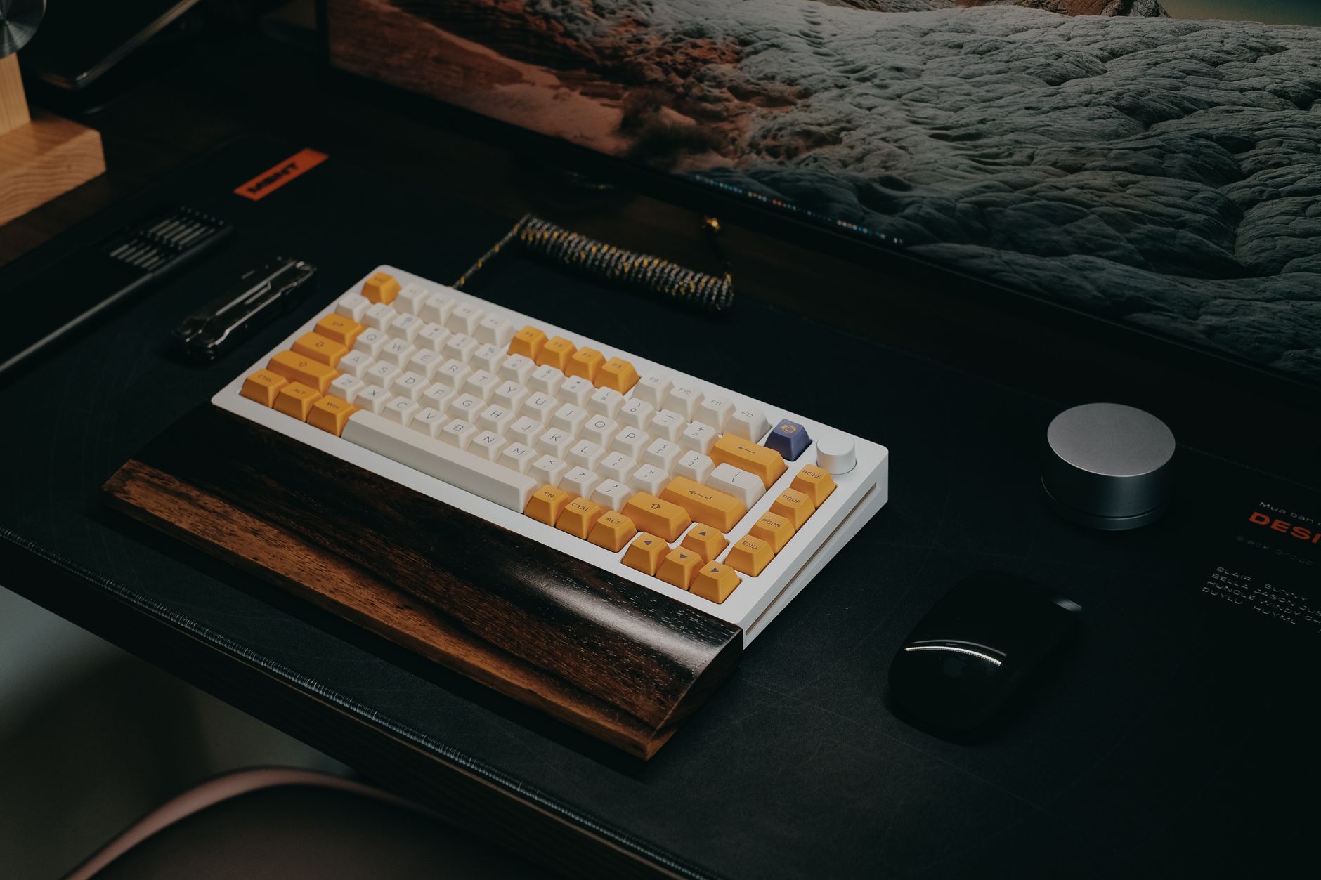 Wide under-desk tray holding a keyboard and mouse below a monitor on a home office desk