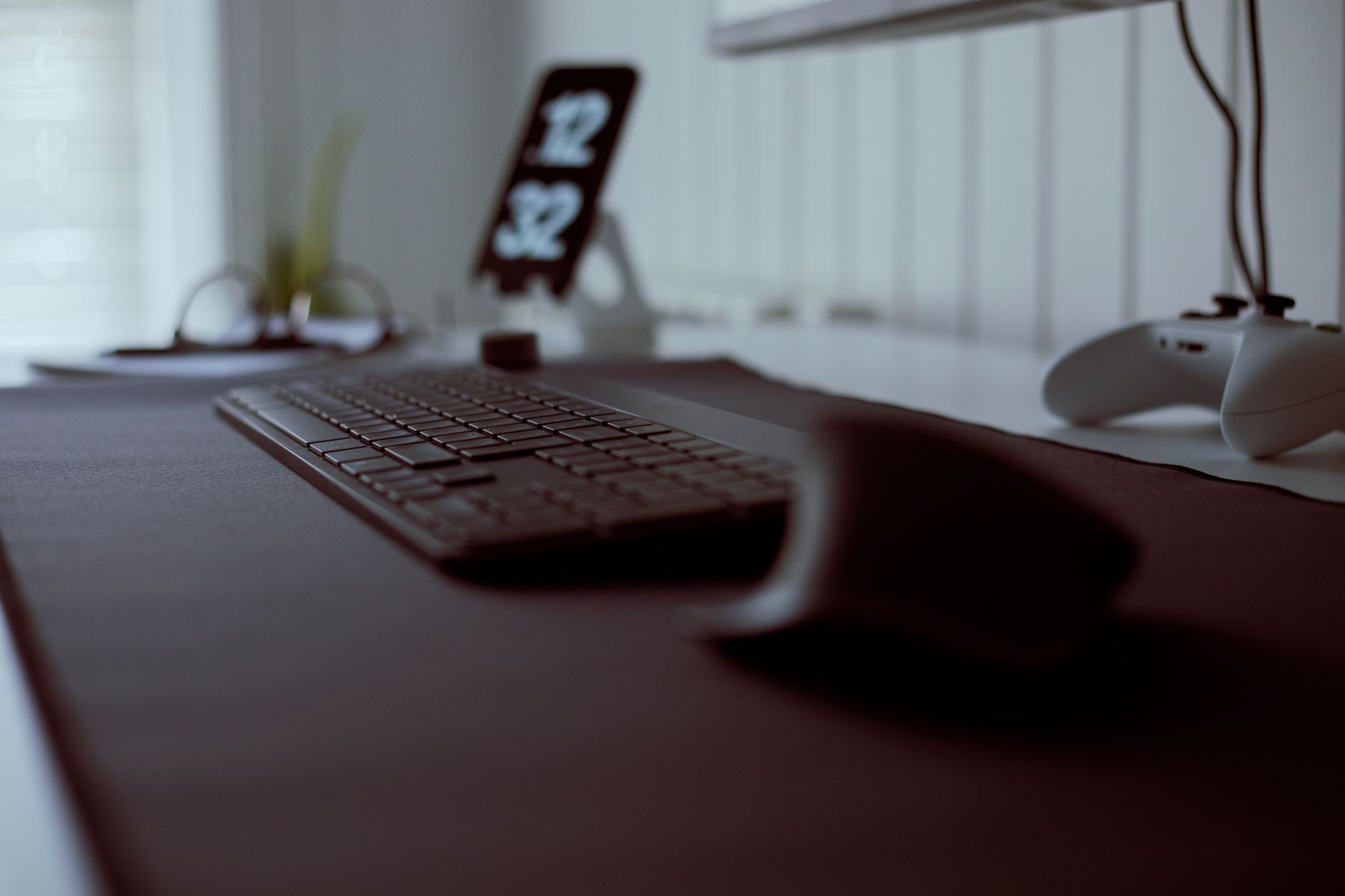 a vertical ergonomic mouse and split keyboard on an office desk
